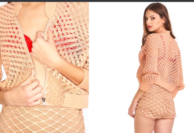 A model wearing 3D printed unbuttoned top and mini skirt