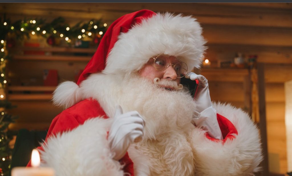 Santa making a phone call and looking surprised - Prank calls numbers