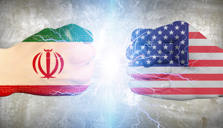 Iranian flag tied in a fist with US flag tied in a fist