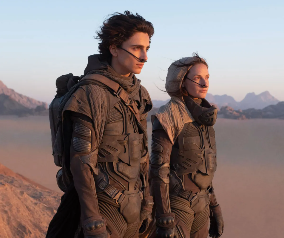 Man and woman looking in a distant with some frustration and fear visibly in their eyes
