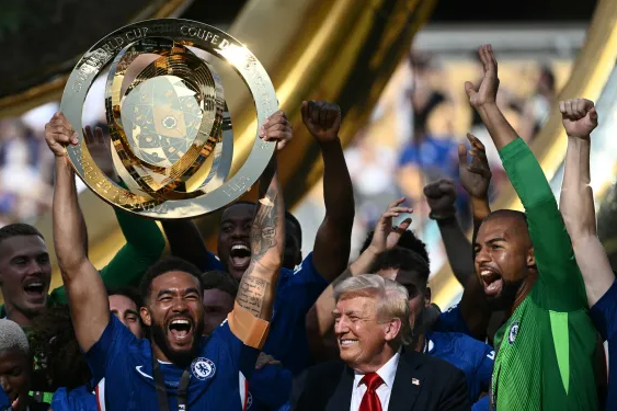 The Chelsea team in all smiles while Trump remains in frame during Club world cup celebration